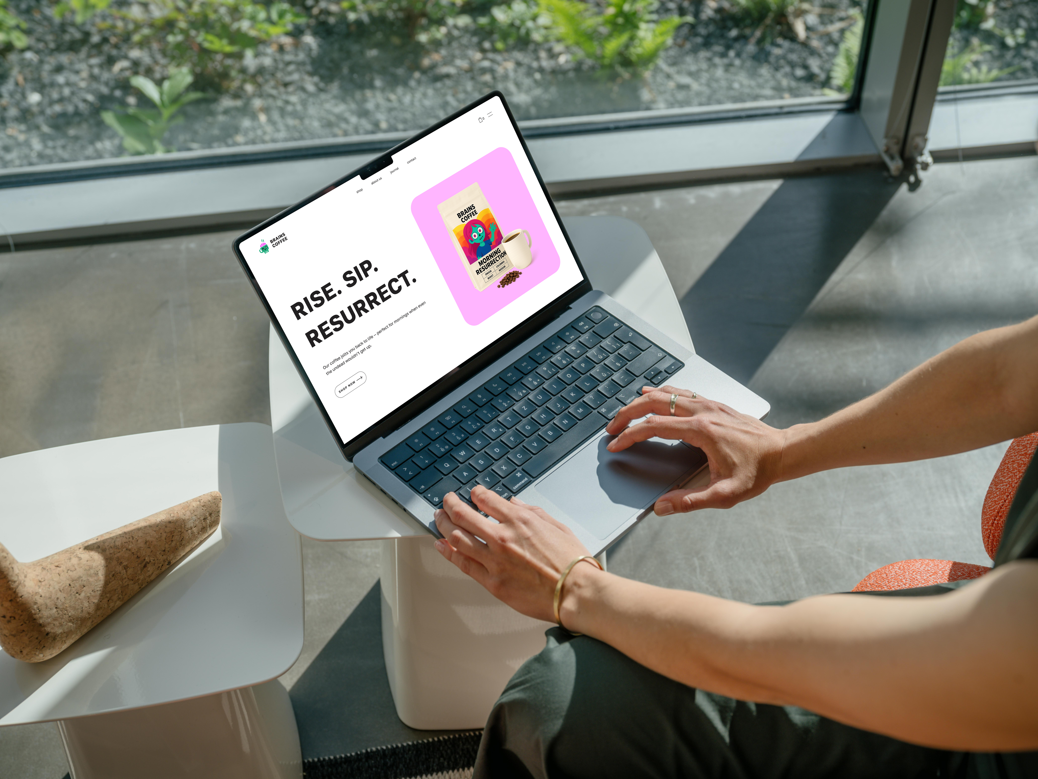 Brains Coffee landing page on laptop